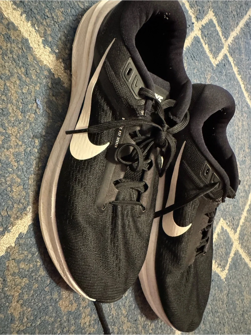 Nike Black Athletic Running Shoes with White Swoosh